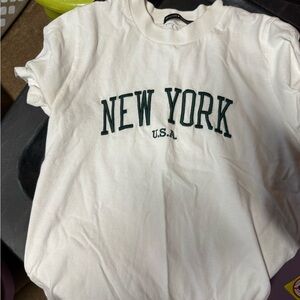 Brandy Melville white t shirt. Green letters